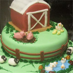 Rolled fondant farm cake with fondant farm animals.