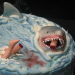 Happy Birthday Shark Bait: Cake with rolled fondant shark attacking a swimmer.
